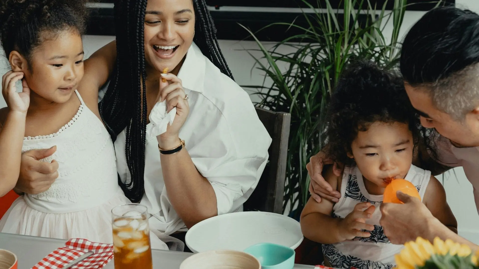 family eating around dinner table