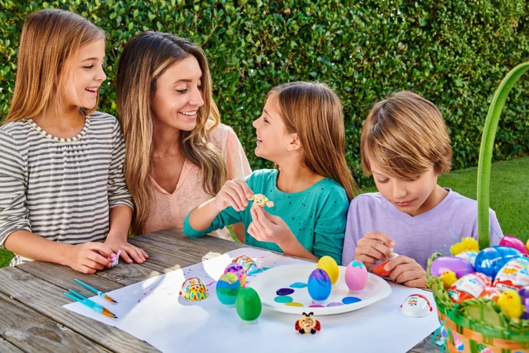 mom and children coloring easter eggs